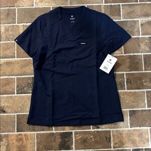 Jaanuu Navy Blue V-Neck Scrub Top
Slim fit NEW with tags size small